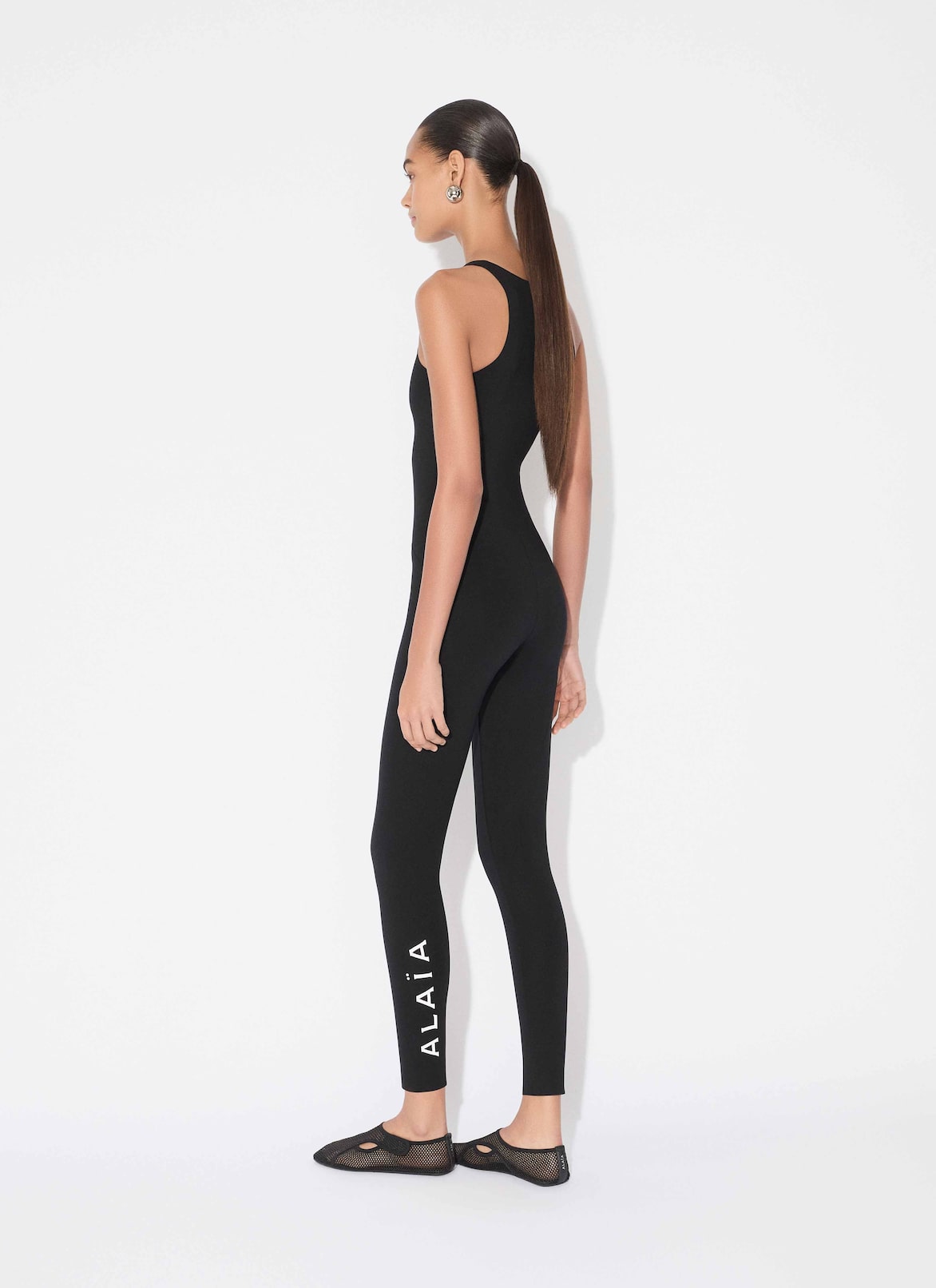COMPACT JERSEY TECHNICAL JUMPSUIT ALAÏA BLACK COMPACT JERSEY TECHNICAL JUMPSUIT